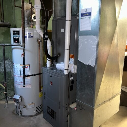 Installed furnace and water heater system in residential basement