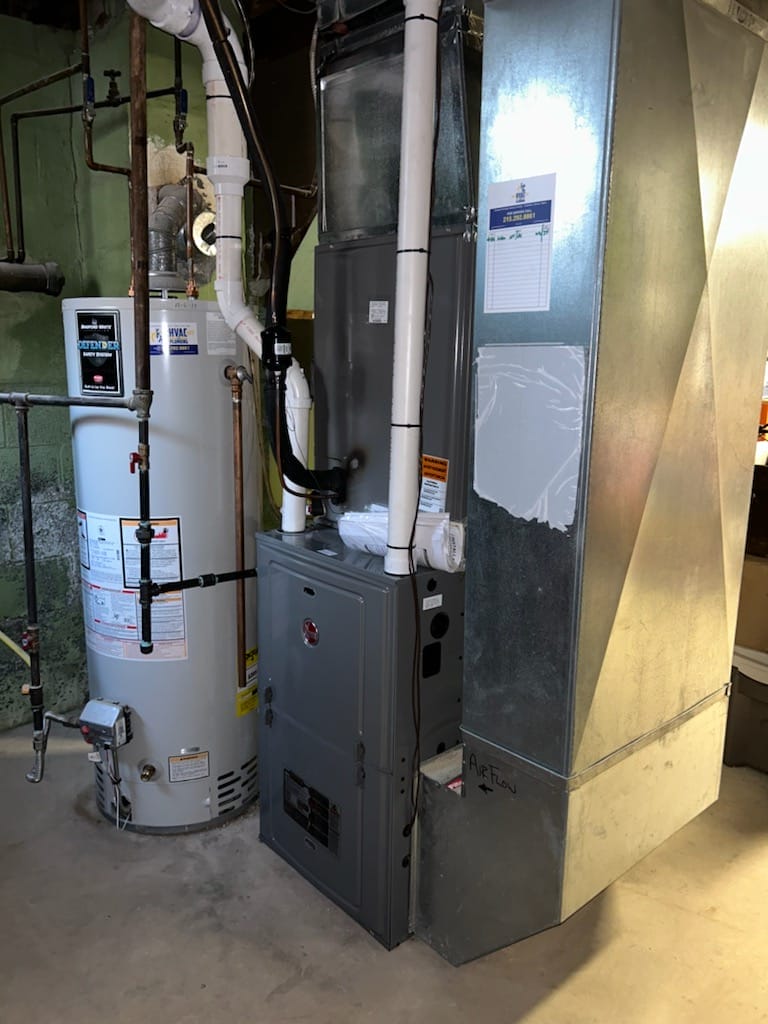 Installed furnace and water heater system in residential basement