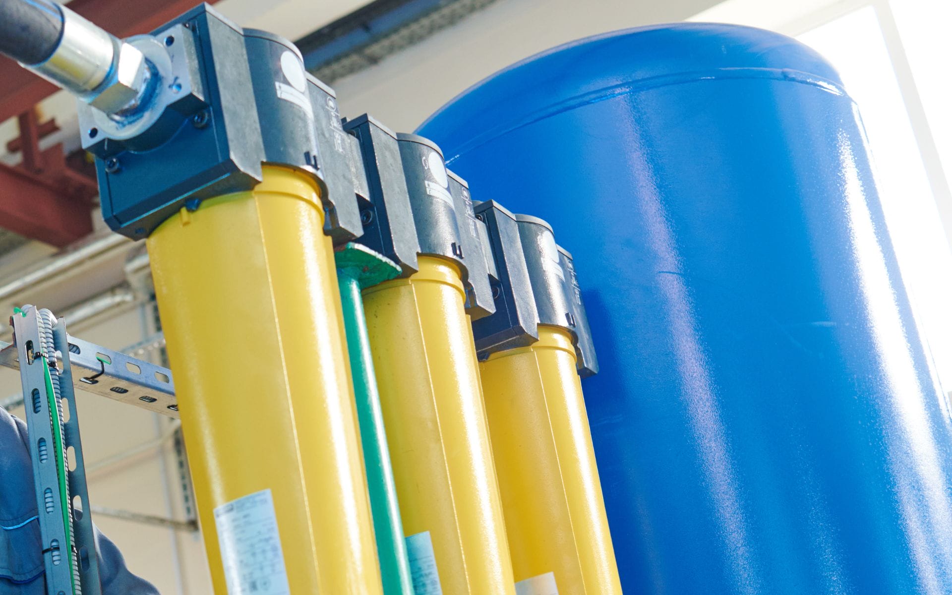 Whole-house water filtration system with tanks and filters