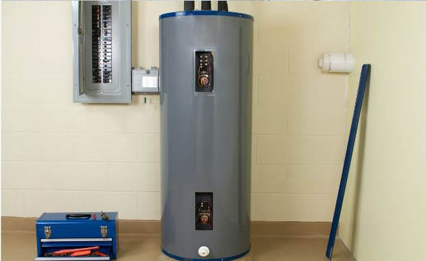 Residential hot water heater with electrical panel and toolbox nearby