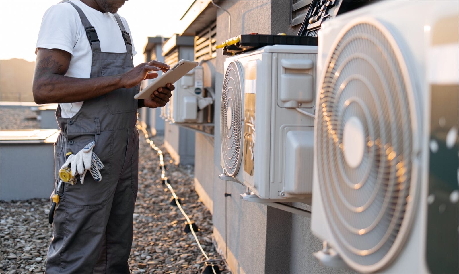 HVAC technician repairing outdoor heat pump system at a residential property in Pennsylvania